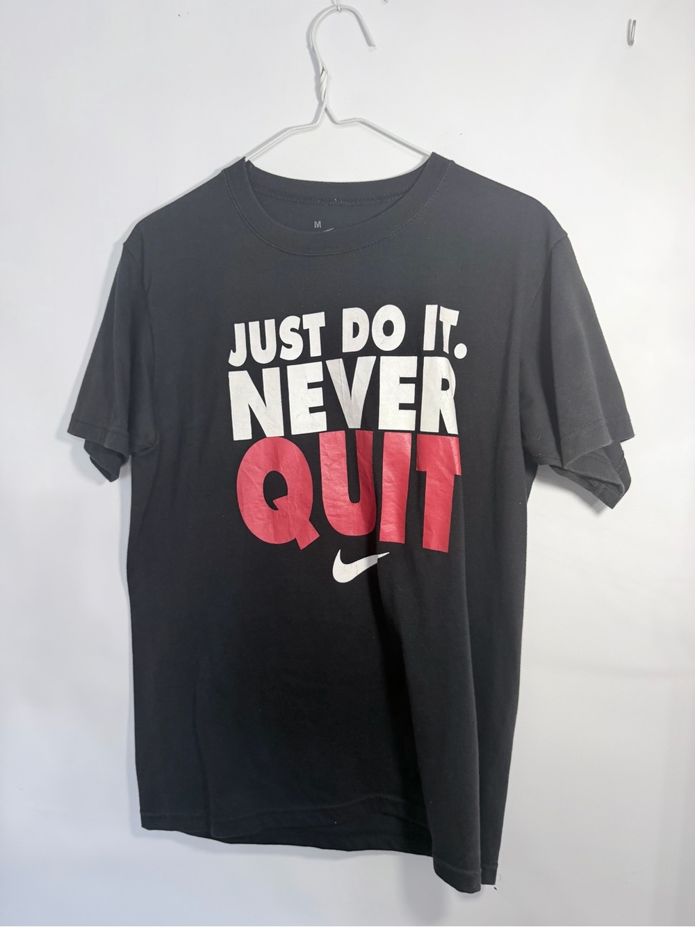 Nike Black Short-Sleeve Graphic Tee with White and Red Text
